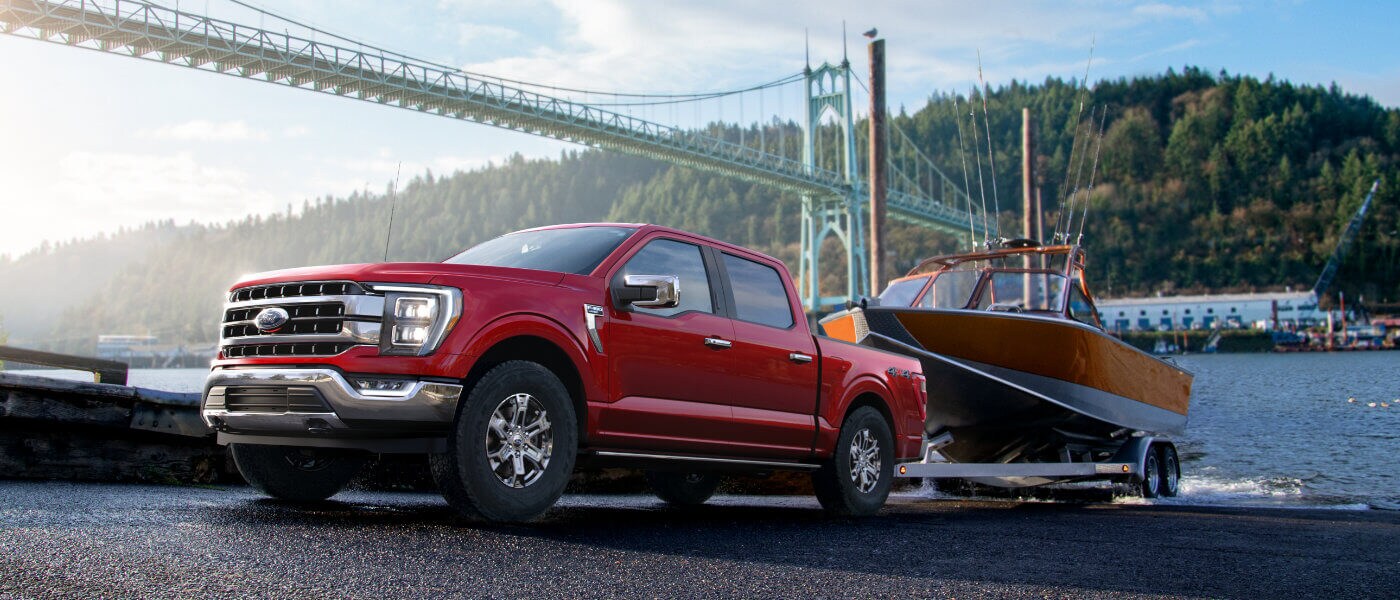 2021 Red Ford F-150 Towing a Boat out of Water