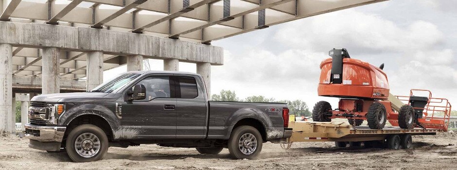 Ford F-250 Towing Capabilities A 2018 Ford F-250 towing a large piece of equipment