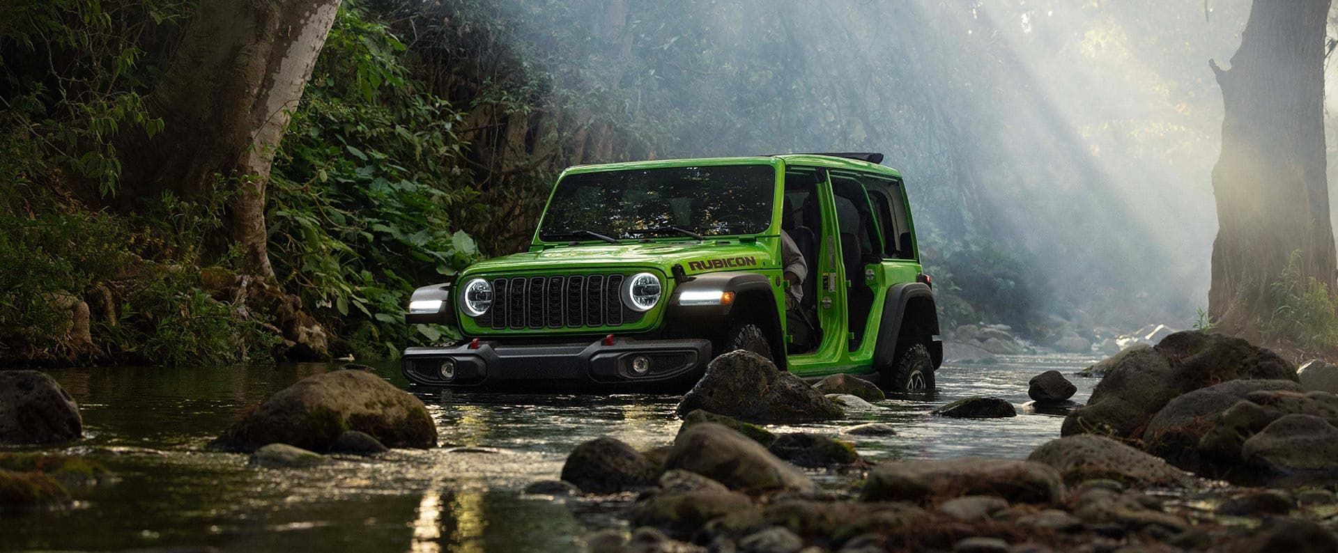 View of the 12.3-inch Uconnect touchscreen display inside the 2026 Jeep Wrangler cabin.