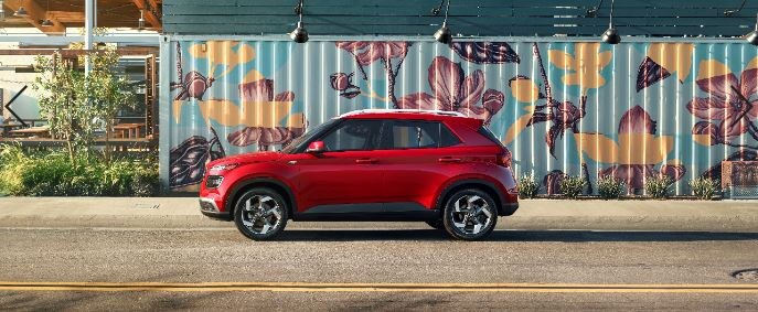 2020 Hyundai Venue red parked by flower graffiti art_res.JPG