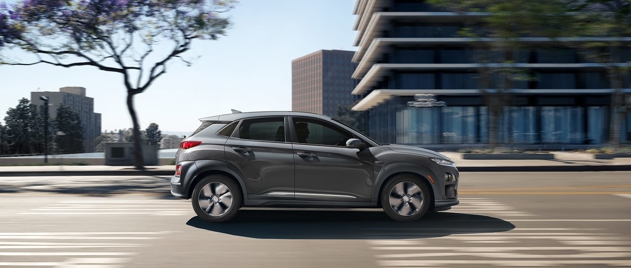2020 hyundai kona electric grey with blurry city buildings in background.jpg