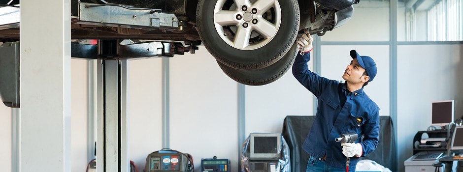 Mechanic Service A mechanic working on a vehicle