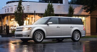 Ford Flex Model Research A white Ford Flex Parked outside of a restaurant