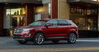 Ford Edge Model Research A red Ford Edge parked outside of a store