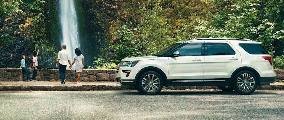 Ford Family SUVs A family driving their Ford SUV to a waterfall
