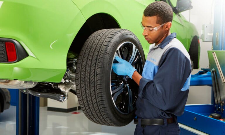 Mechanic replacing a tire