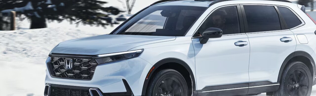 Discover-the-2025-Honda-CR-V-Hybrid-Efficiency-%26-Power.png A brand-new 2025 Honda CR-V Hybrid parked at White's Auto Mall Honda.