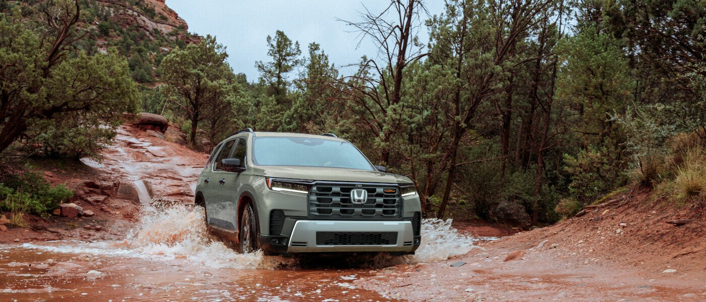 2026 Honda Pilot driving through stream