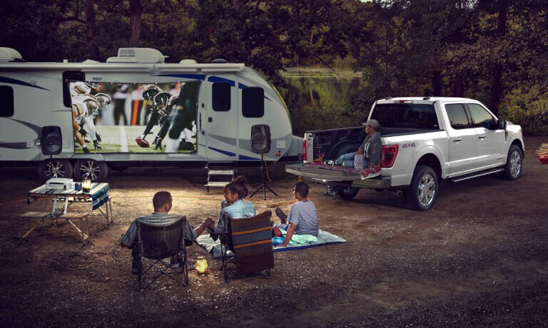 2026 Ford F-150 with RV and family watching football