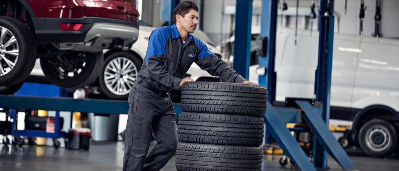 Ford Service Technician With Tires