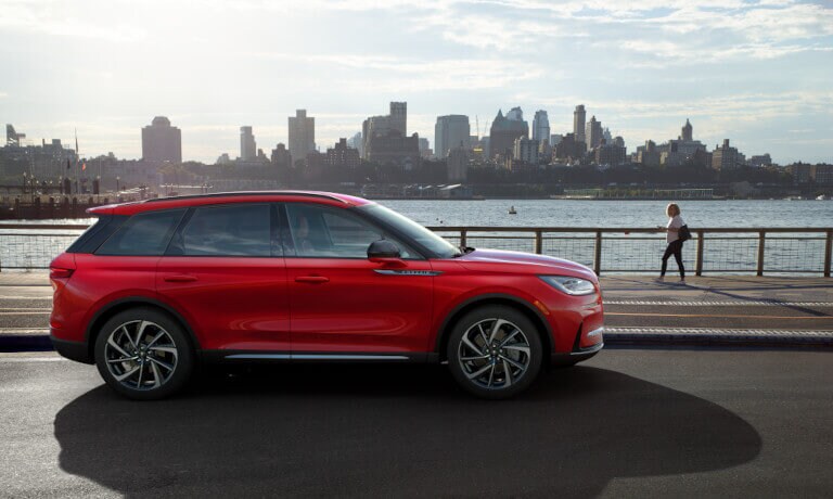 2026 Lincoln Corsair side view by city skyline