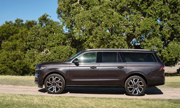 2025 Lincoln Navigator side view on dirt road