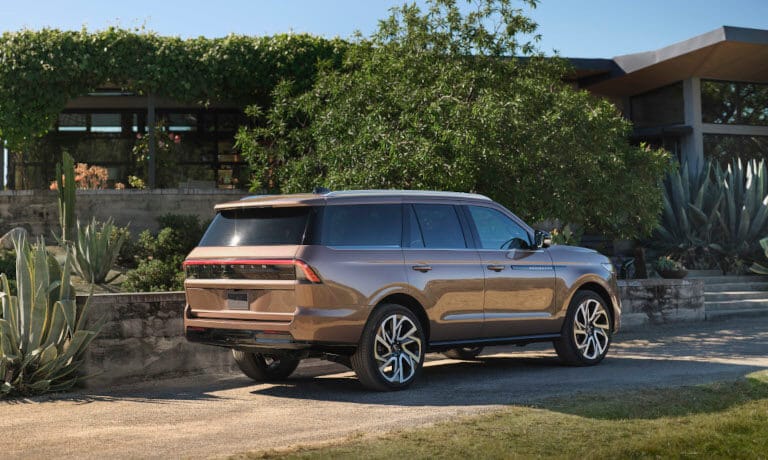 2025 Lincoln Navigator facing away on dirt driveway