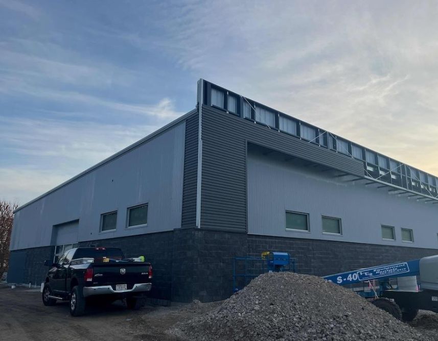 Corrugated Metal Paneling Installation In Progress. Corrugated Metal Paneling Installation In Progress.