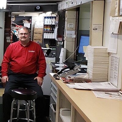 Service Manager Behind Counter