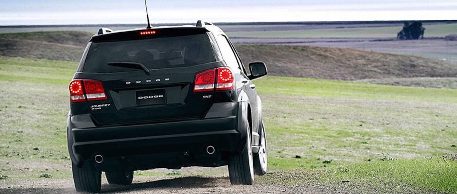 Test Drive a 2018 Dodge Journey Today A 2018 Dodge Journey driving through a field