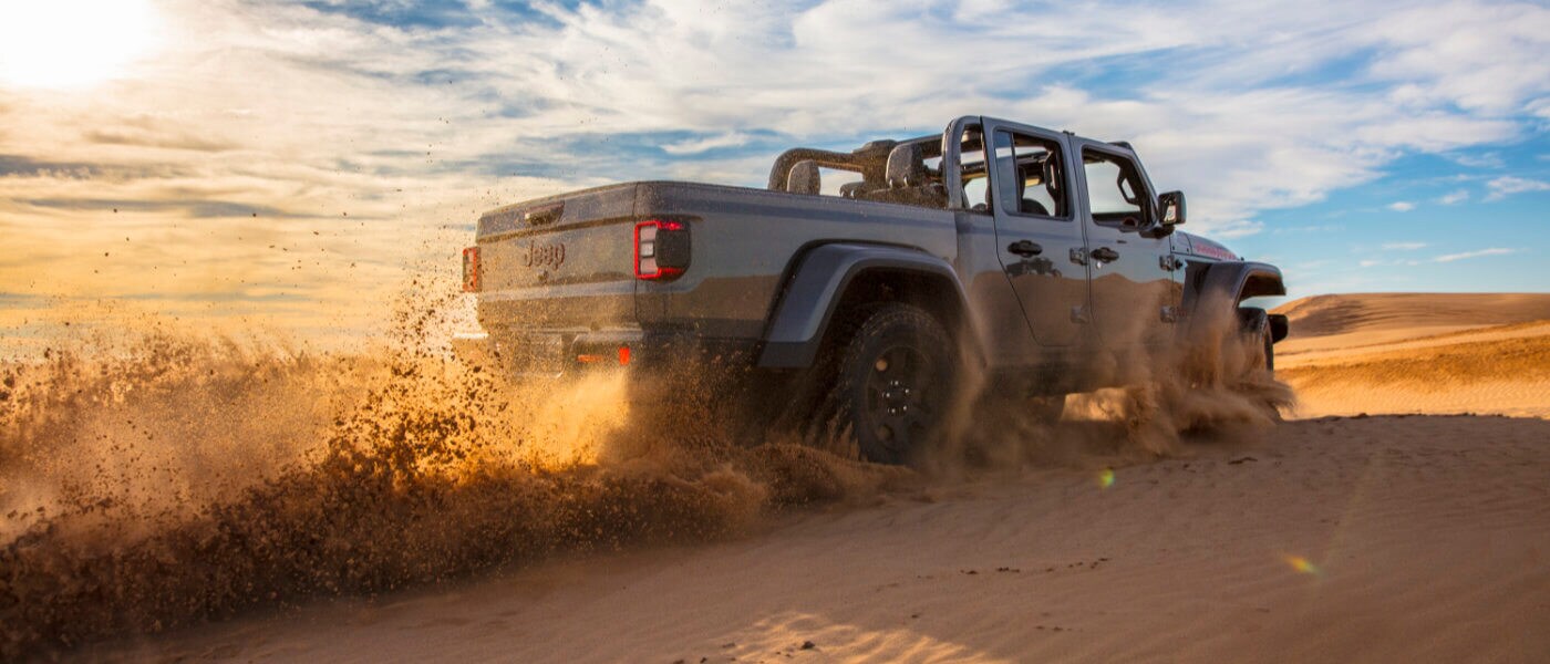 2021 Jeep Gladiator driving through sand