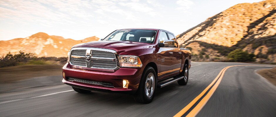 Chrysler, Dodge, Jeep, Ram Finance Center A Ram 1500 driving down an open road