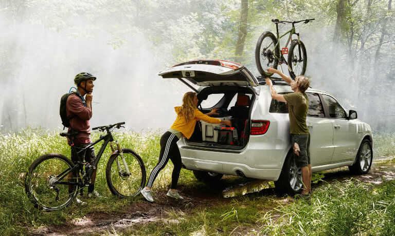 2022 Dodge Durango exterior in forest with bikers