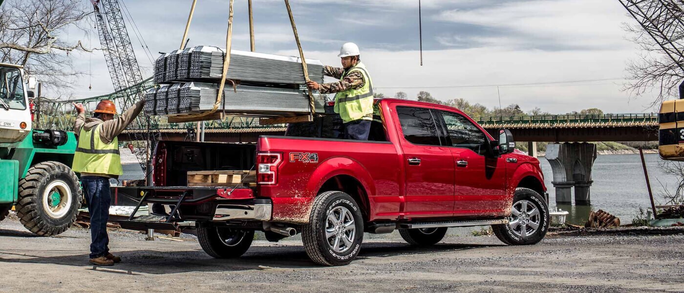 2019 Ford F-150 at construction site with heavy payload on crane