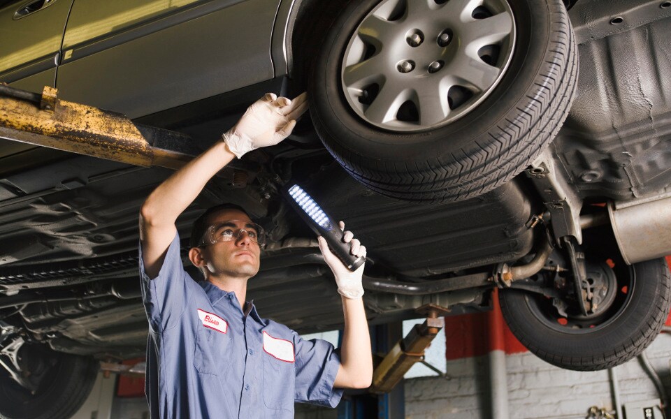 Tire inspection mechanic inspecting tires