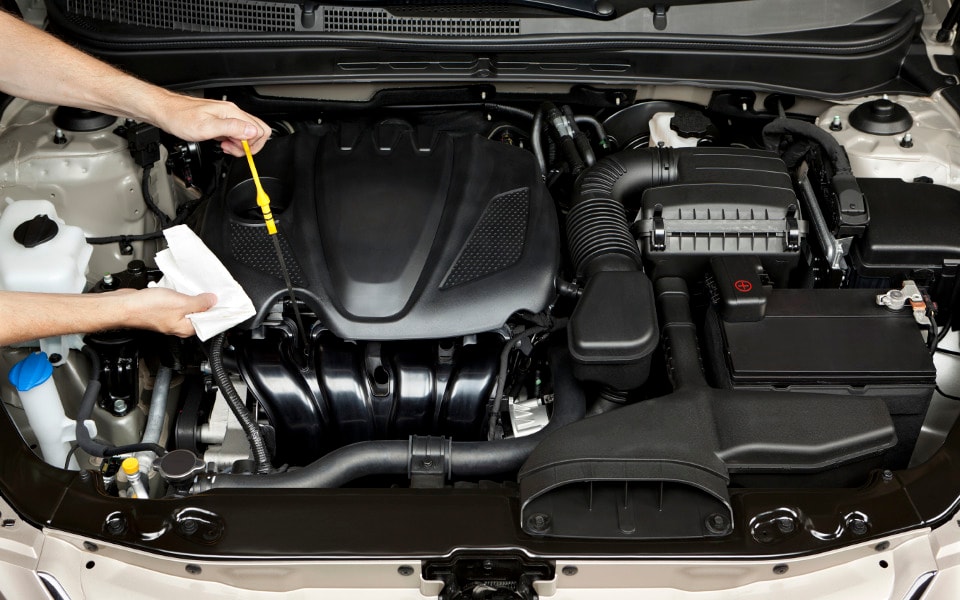 Motor oil inspection mechanic checking motor oil