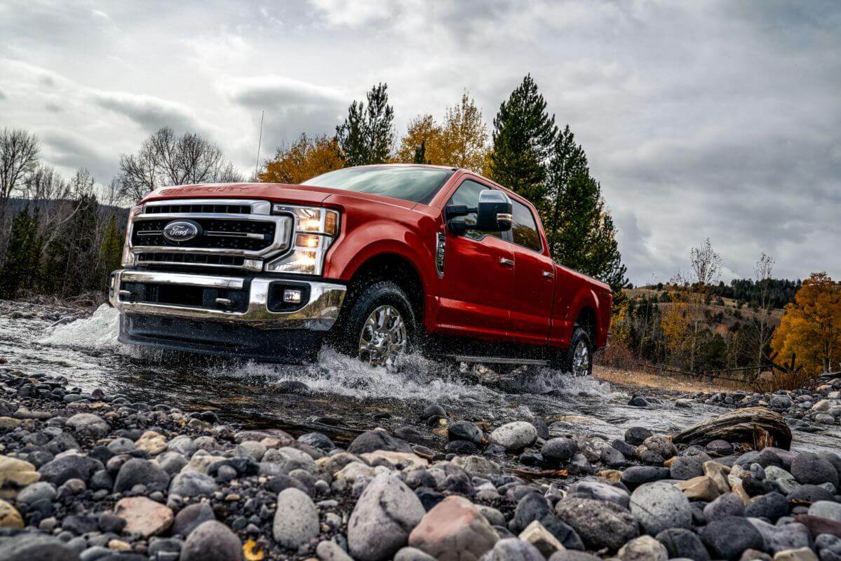 Red%20Truck%20Driving%20on%20a%20rockbed.jpg