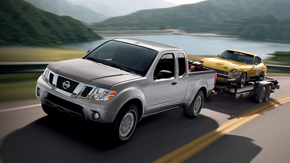 2015 Nissan Frontier Towing a Trailer.jpg Silver 2015 Nissan Frontier King Cab Towing Trailer with Yellow Classic 240z