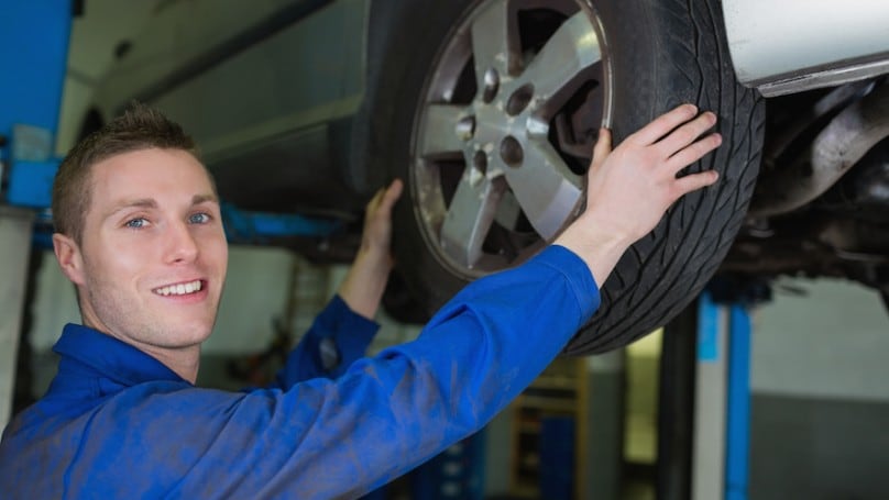 Mechanic-changing-a-tire-copy-808x455.jpg