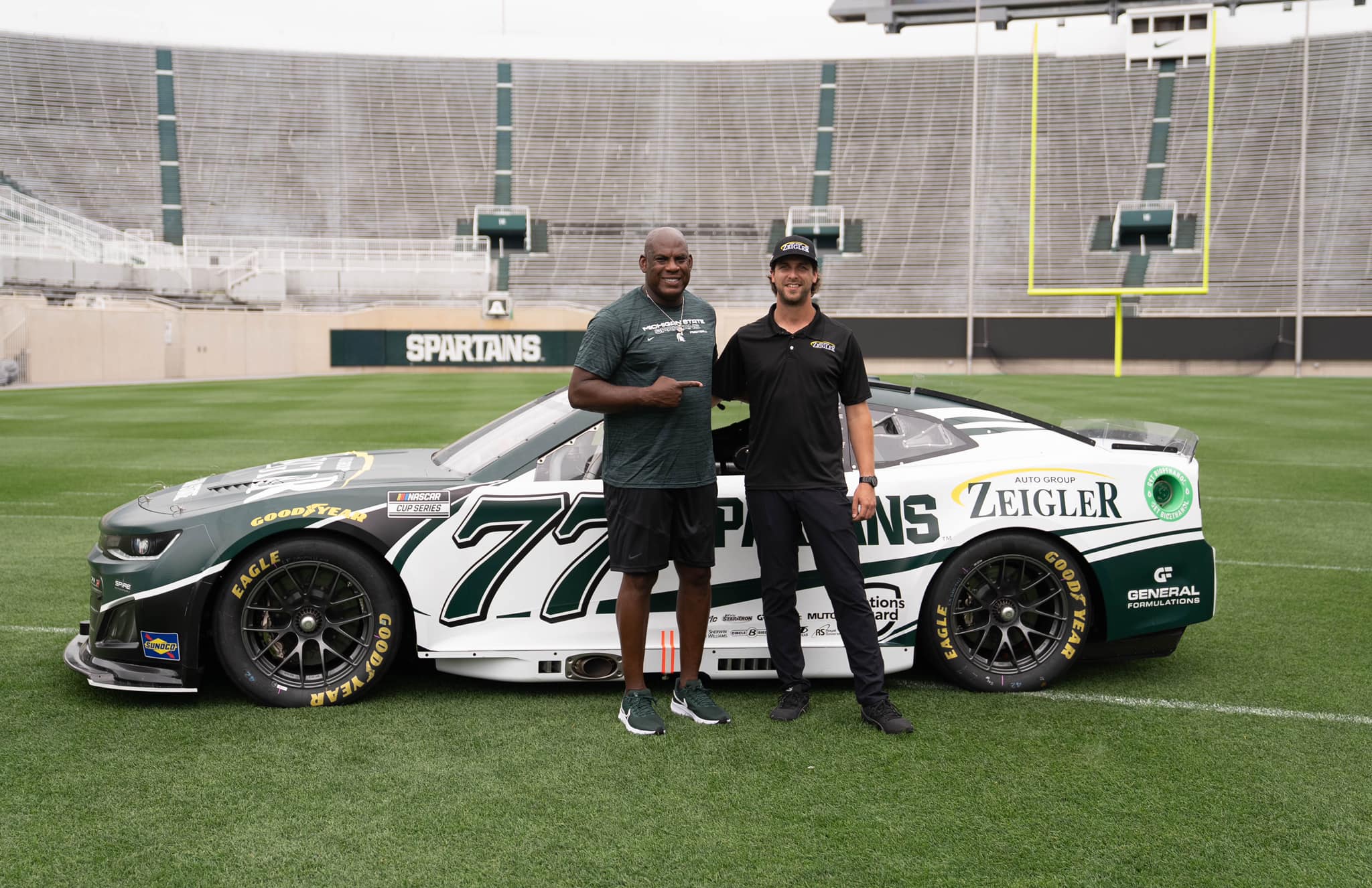 BigTenCoach-MelTucker-NASCARDriverJoshBilicki-ZeiglerxMSUSpartan-77Camaro-Onthefield.jpeg