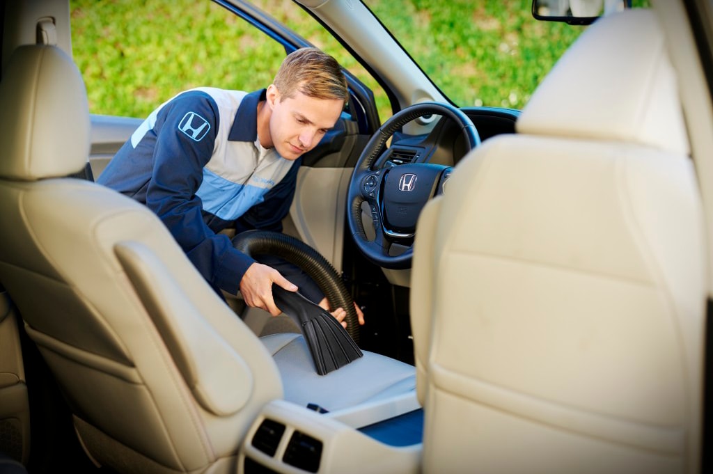  Person cheerfully signing documents.