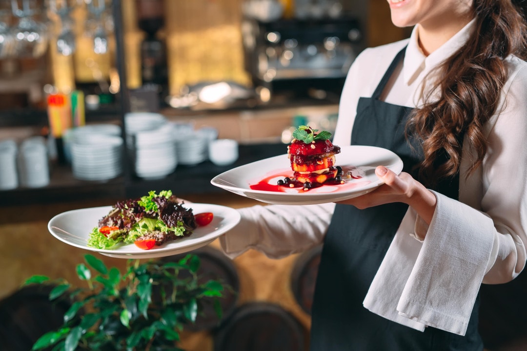 a%20server%20holding%20two%20plates%20of%20food.jpg