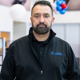 Staff member Calvin Gulam from ID_6f6ba9e724cc