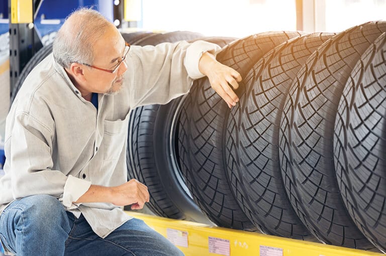 A customer looking at tires
