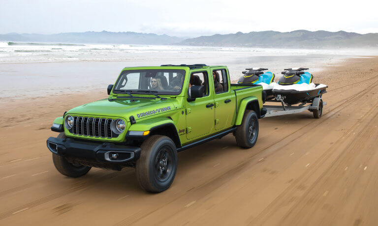 2026 Jeep Gladiator Exterior Driving On Beach With Jetskis