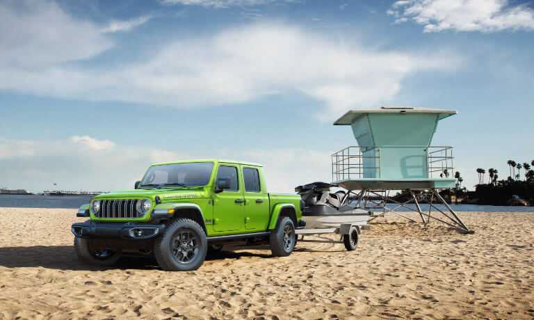 2026 Jeep Gladiator Exterior Parked Near Beach Guard Stand With Jetskis
