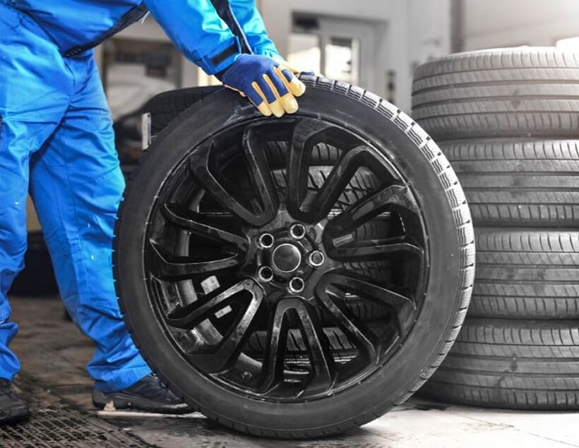 Technician moving wheel