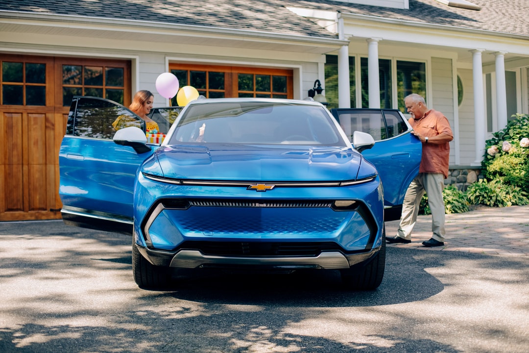  Person cheerfully signing documents.