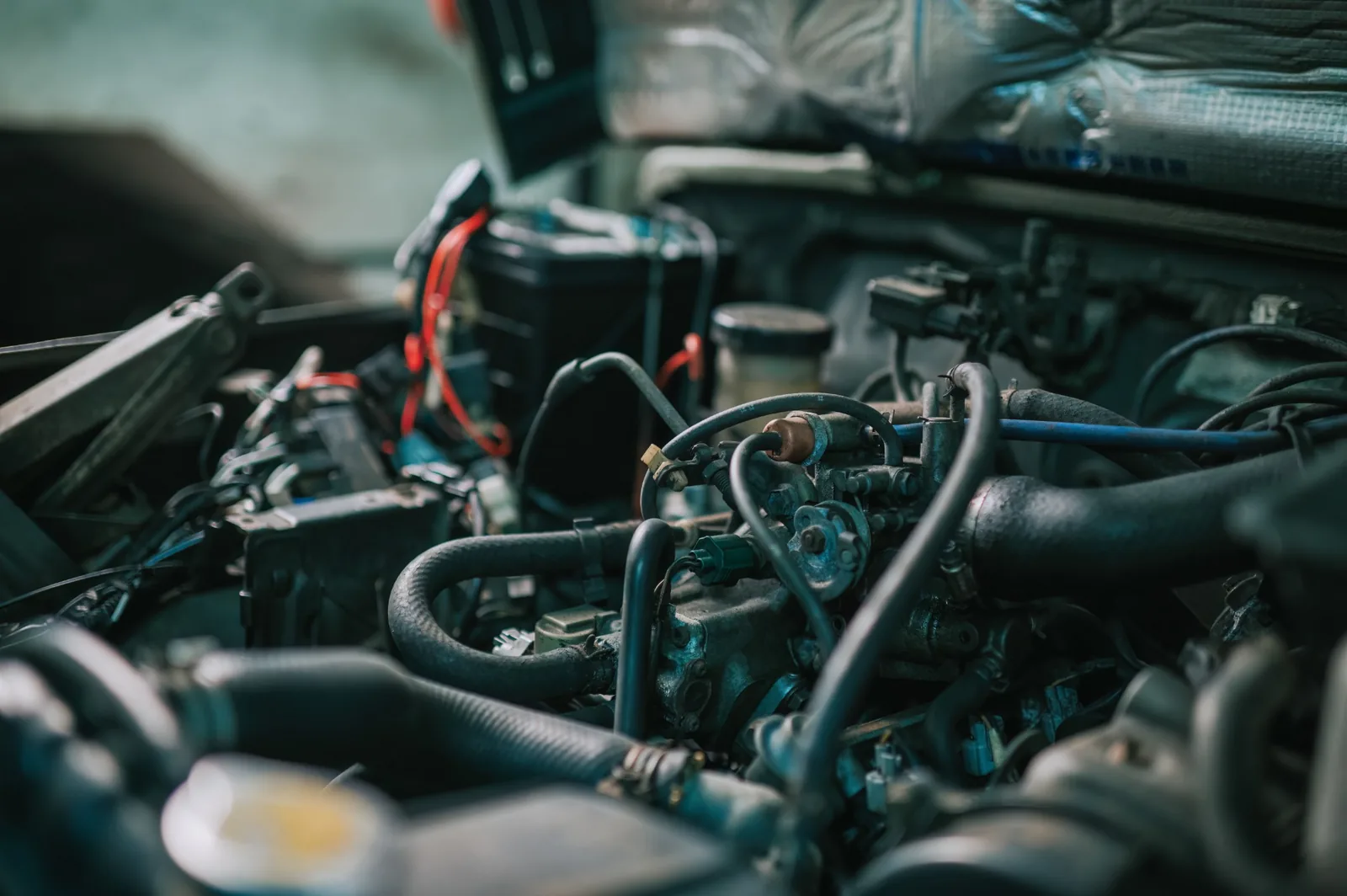 Engine bay during professional maintenance and tune-up service