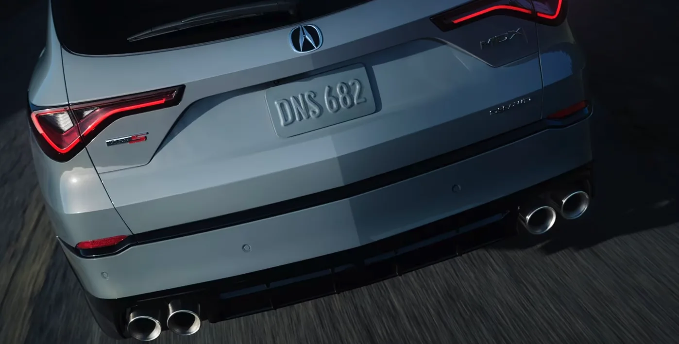 Rear detail of a 2026 Acura MDX Type S with badge and exhaust outlets