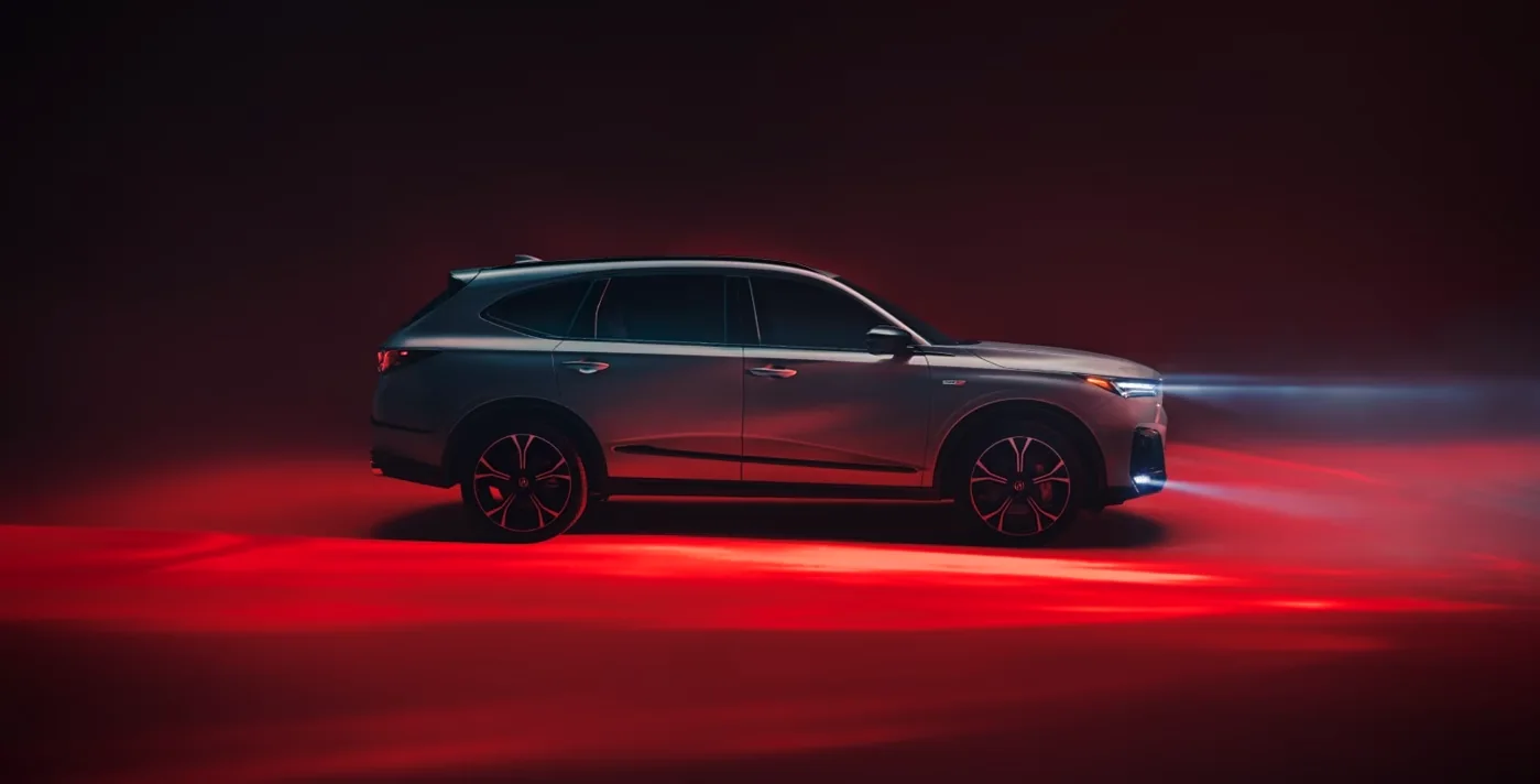 Side profile of a 2026 Acura MDX with red accent lighting