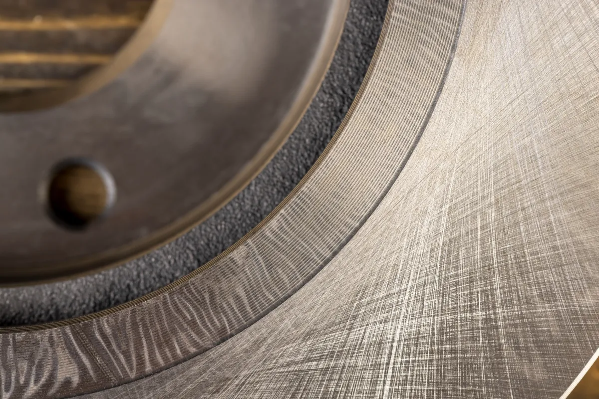 Close-up of worn Acura brake rotor showing wear