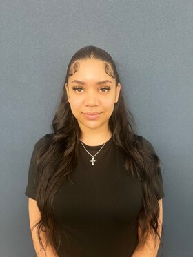Staff member Lauren Palomita Reyes from 588769f64d1c