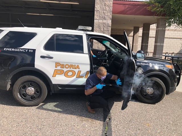 Acura of Peoria staff cleaning police vehicles