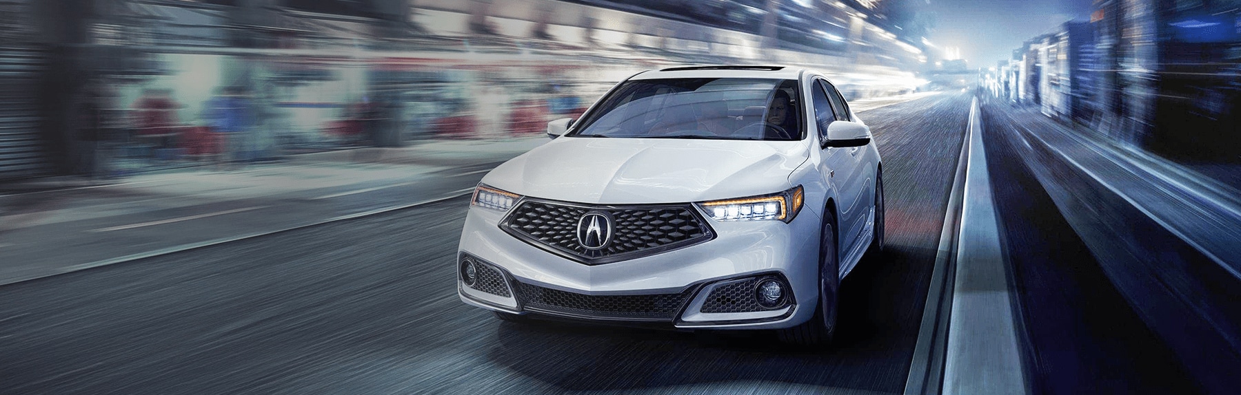 white-2020-acura-ILX-driving-down-city-street.png