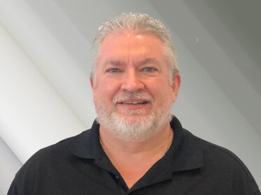 Staff member John Mack from ID_b70716