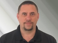 Staff member Tom Analitis from ID_6c26ee