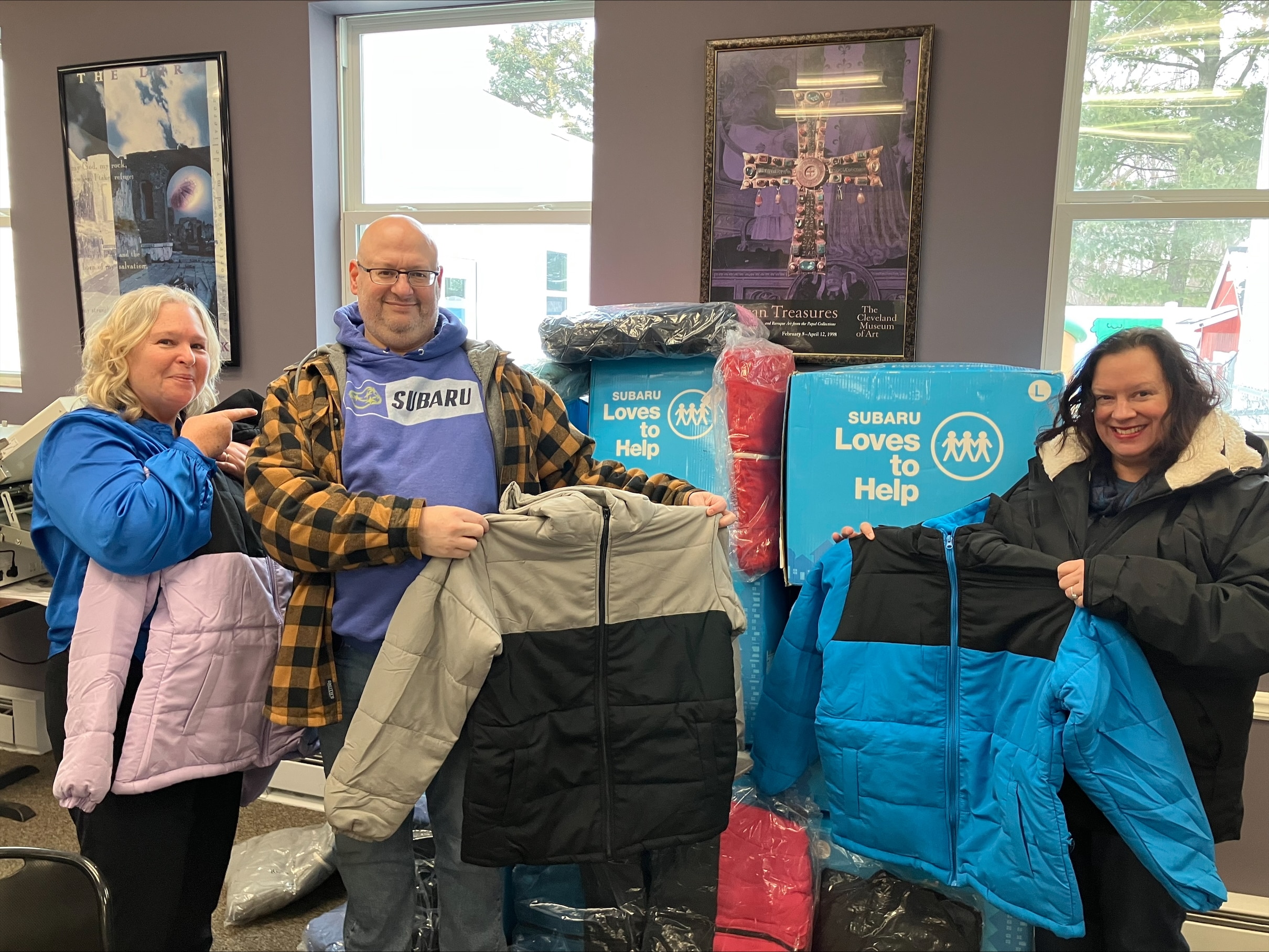 People holding coats