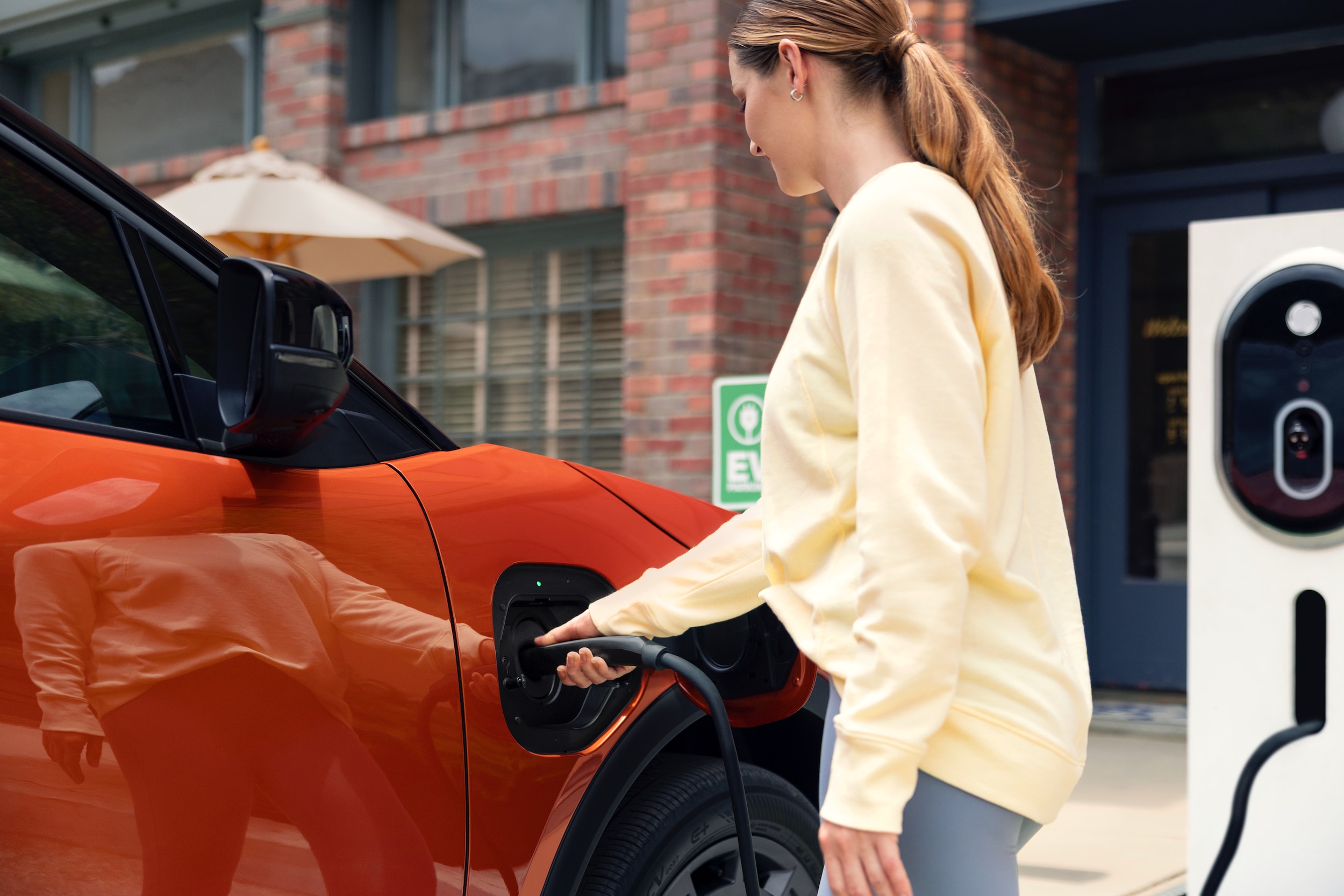 Person using the charging port on the 2026 Subaru Uncharted EV