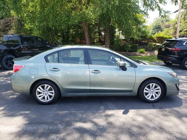 Used 2016 Subaru Impreza Premium with VIN JF1GJAB68GH010828 for sale in Painesville, OH